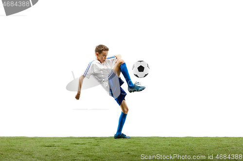 Image of Young boy with soccer ball isolated on white. football player