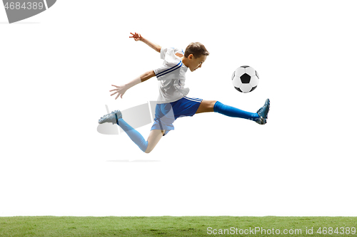 Image of Young boy with soccer ball isolated on white. football player