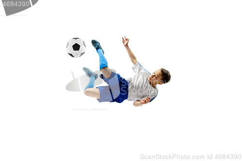 Image of Young boy with soccer ball isolated on white. football player