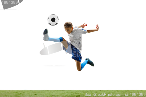 Image of Young boy with soccer ball isolated on white. football player