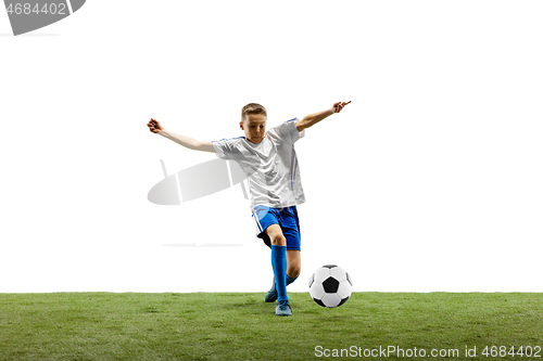Image of Young boy with soccer ball isolated on white. football player
