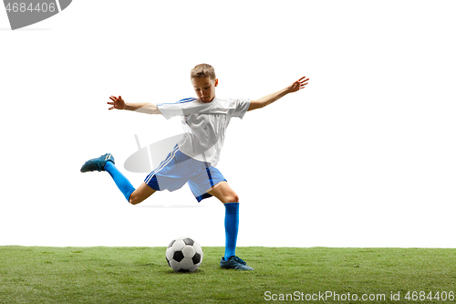 Image of Young boy with soccer ball isolated on white. football player