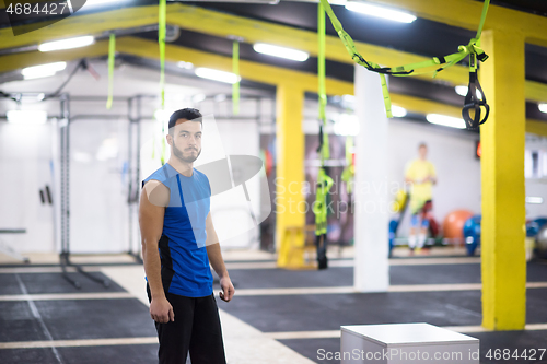 Image of portrait of young man at cross fitness gym