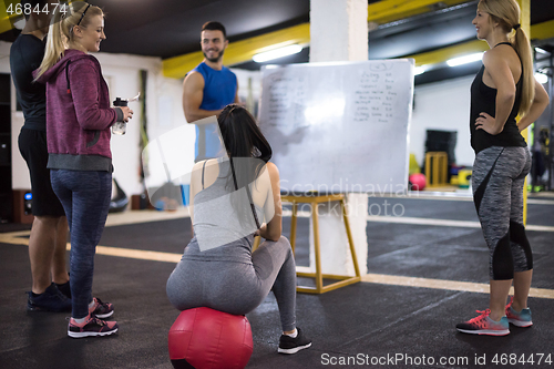 Image of athletes getting instructions from trainer