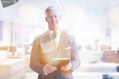 Image of Senior businessman in his office