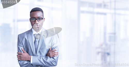 Image of Young businessman in his office