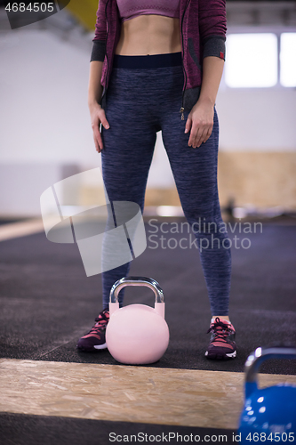 Image of woman exercise with fitness kettlebell