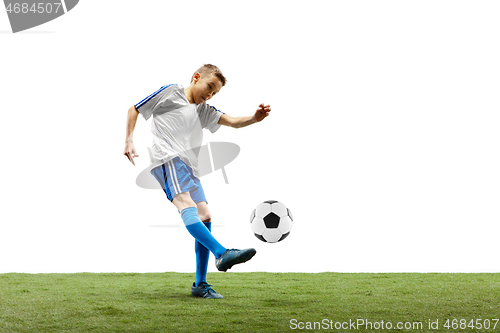 Image of Young boy with soccer ball isolated on white. football player