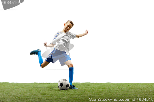 Image of Young boy with soccer ball isolated on white. football player