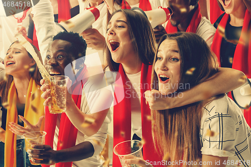 Image of Group of happy fans are cheering for their team victory.