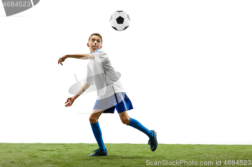 Image of Young boy with soccer ball isolated on white. football player