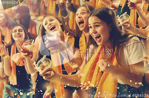 Image of Group of happy fans are cheering for their team victory.