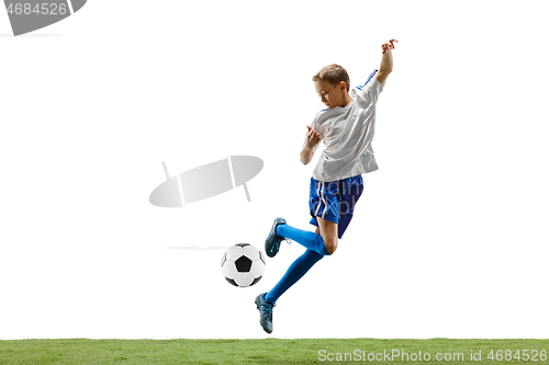 Image of Young boy with soccer ball isolated on white. football player