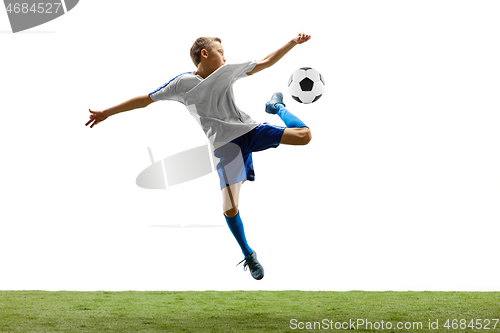 Image of Young boy with soccer ball isolated on white. football player