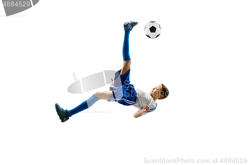 Image of Young boy with soccer ball isolated on white. football player