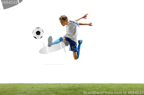 Image of Young boy with soccer ball isolated on white. football player