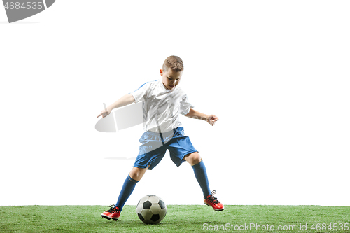 Image of Young boy with soccer ball isolated on white. football player