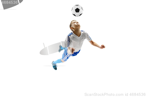 Image of Young boy with soccer ball isolated on white. football player