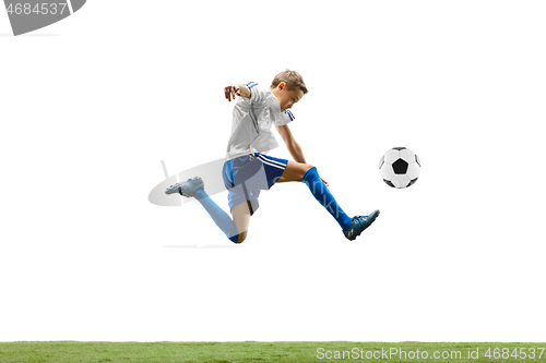 Image of Young boy with soccer ball isolated on white. football player