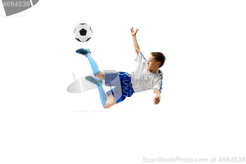 Image of Young boy with soccer ball isolated on white. football player