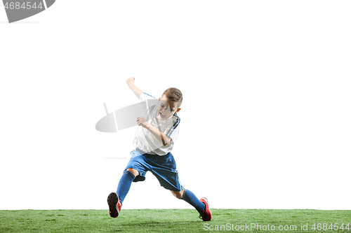 Image of Young boy with soccer ball isolated on white. football player