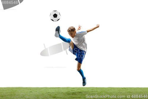 Image of Young boy with soccer ball isolated on white. football player