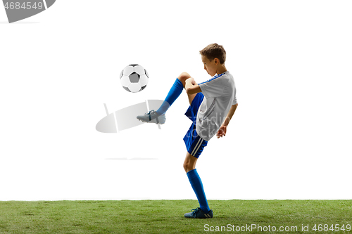 Image of Young boy with soccer ball isolated on white. football player