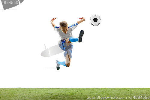 Image of Young boy with soccer ball isolated on white. football player