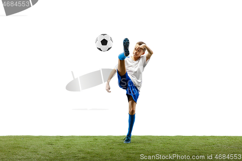 Image of Young boy with soccer ball isolated on white. football player