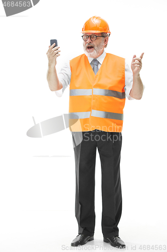 Image of The builder in orange helmet isolated on white