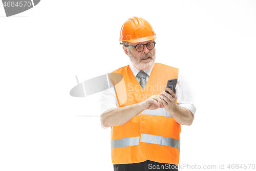 Image of The builder in orange helmet isolated on white