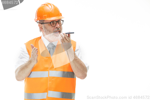 Image of The builder in orange helmet isolated on white