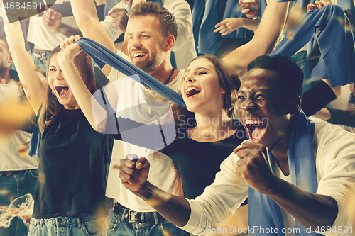 Image of Group of happy fans are cheering for their team victory.