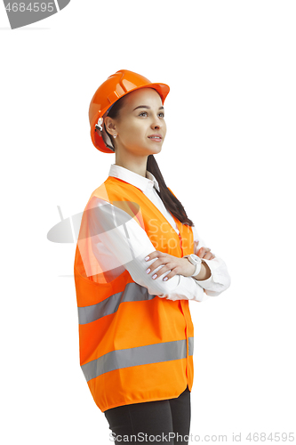 Image of The female builder in orange helmet isolated on white