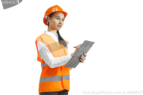 Image of The female builder in orange helmet isolated on white