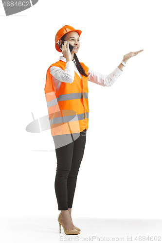 Image of The female builder in orange helmet isolated on white