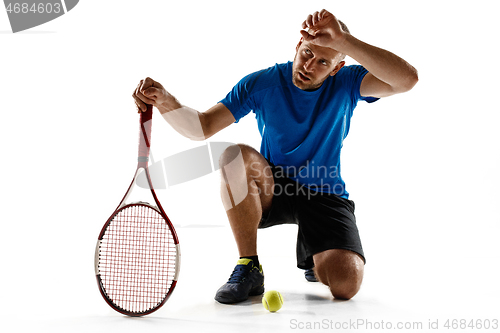 Image of Tennis player crouching down looking defeated and sad