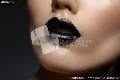 Image of beautiful girl with black lips