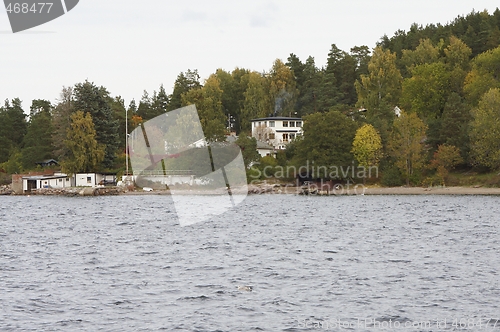 Image of Norwegian house near the sea.