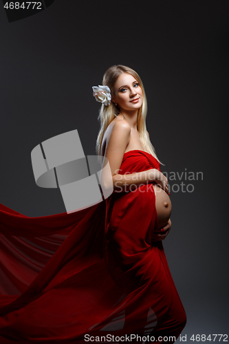 Image of Pregnant girl in red dress