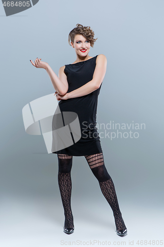 Image of girl in small black dress