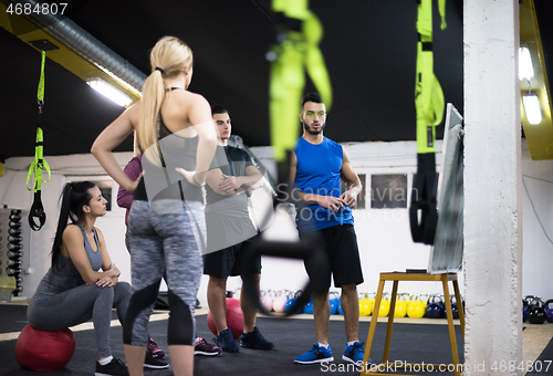 Image of athletes getting instructions from trainer