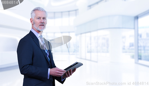 Image of Senior businessman in his office