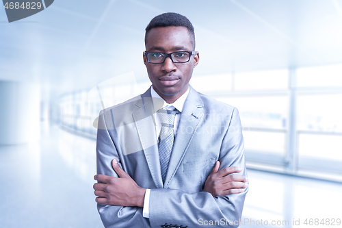 Image of Young businessman in his office