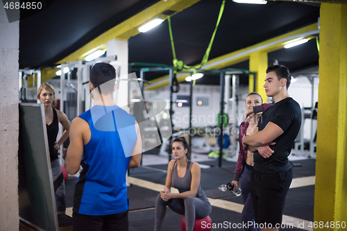 Image of athletes getting instructions from trainer