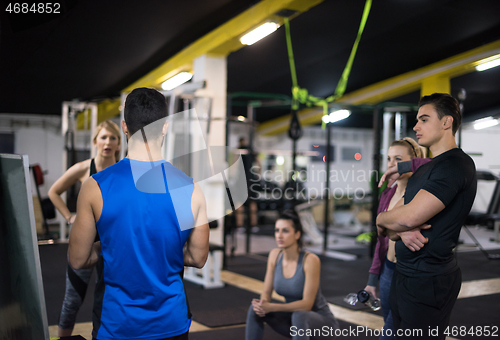 Image of athletes getting instructions from trainer