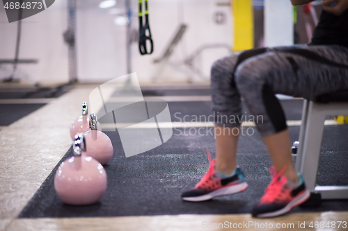 Image of woman exercise with fitness kettlebell