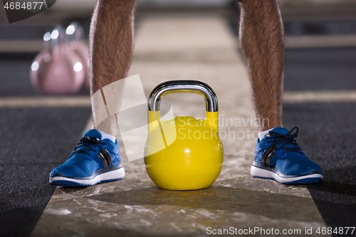 Image of man exercise with fitness kettlebell