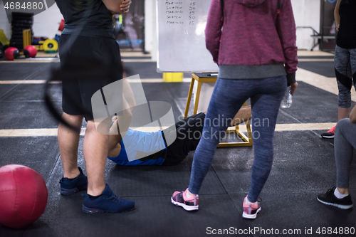 Image of athletes getting instructions from trainer