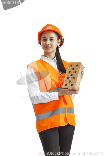 Image of The female builder in orange helmet isolated on white